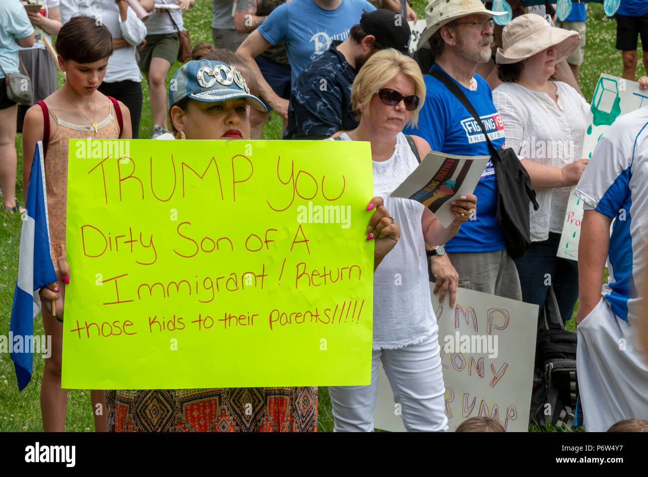 Detroit, Michigan - Protesters oppose the Trump administration's policy of separating young children from their parents at the U.S.-Mexico border. The Stock Photo