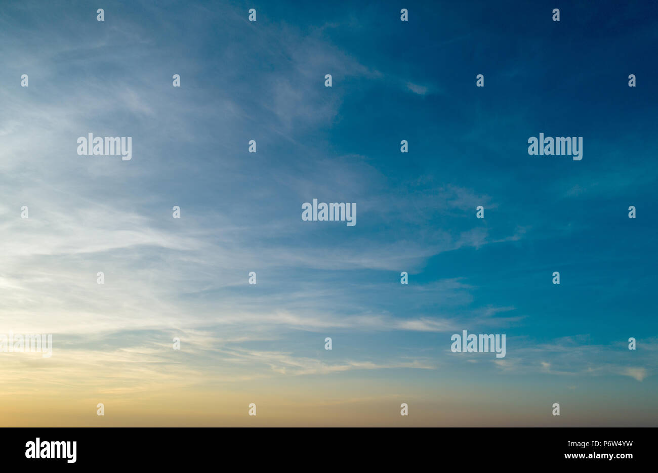 Blue and orange Sunset sky with clouds Stock Photo - Alamy