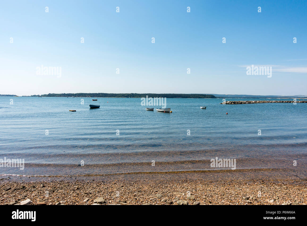 Boats floating in Poole Harbour on a warm sunny summers day, June 2018,  Poole, Dorset, England, United Kingdom Stock Photo