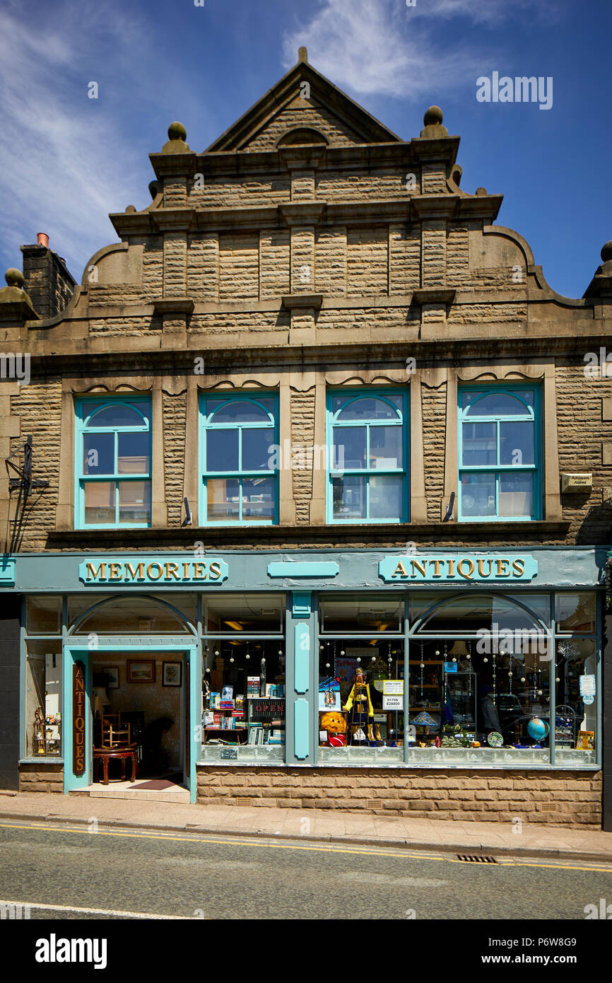 Uphill sandstone independent shops including a large antiques shop on  Bridge Street, Ramsbottom village, Lancashire. Stock Photo