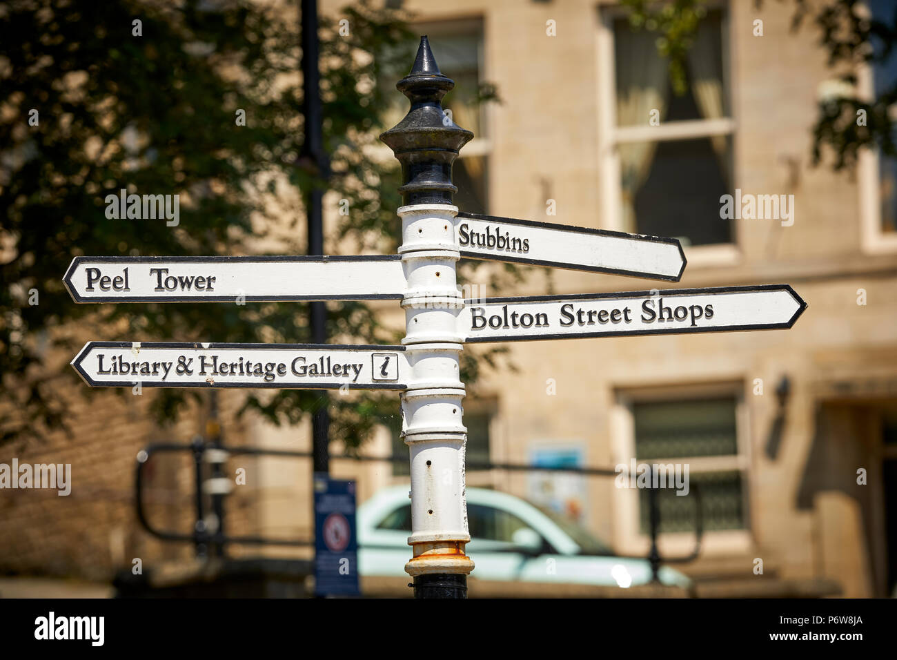 Cast Iron destination sign pointing at Peel tower. Market Place ...