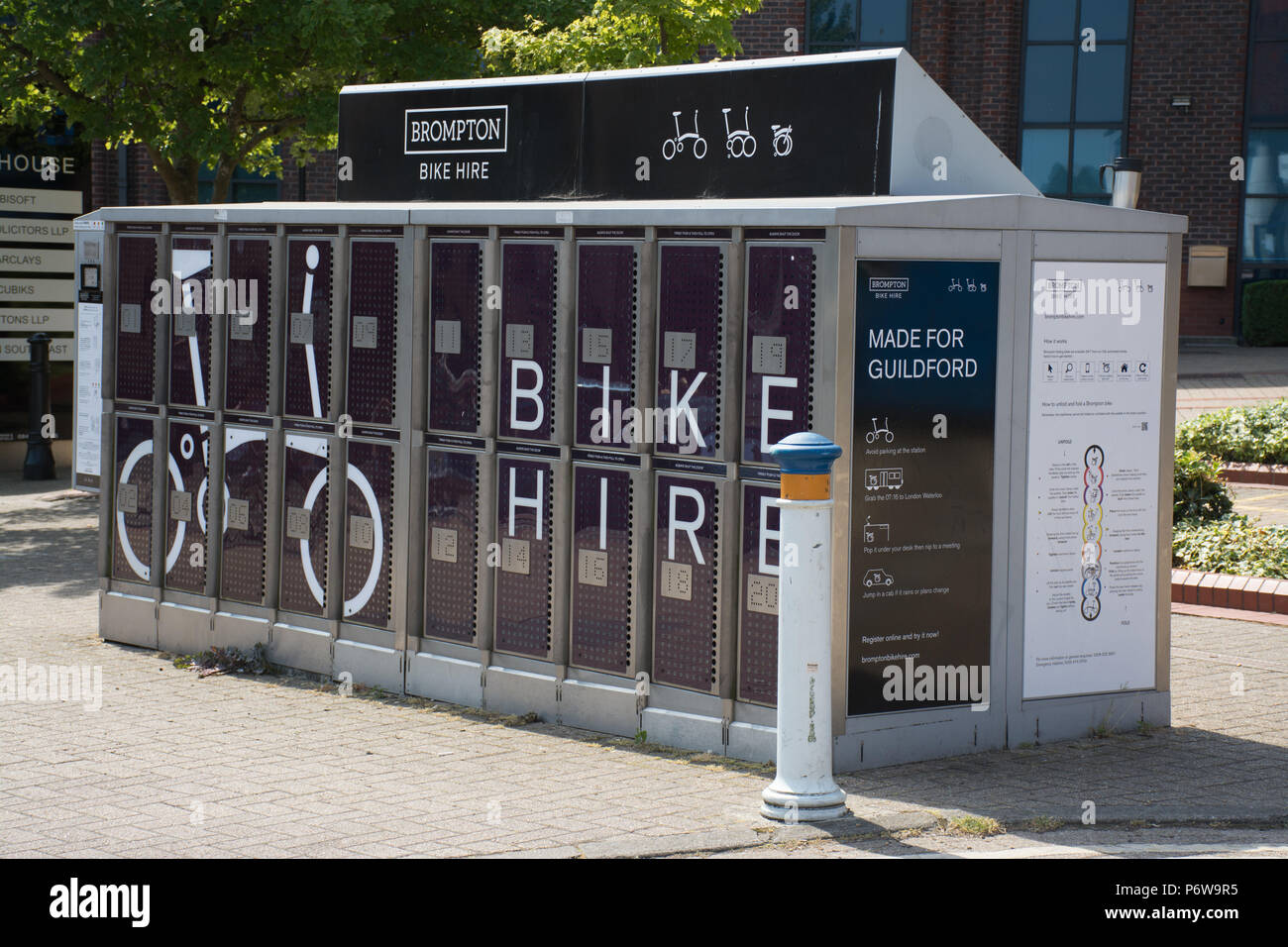 Self-service Brompton bike hire facility at the railway station in Guildford town, Surrey, UK Stock Photo