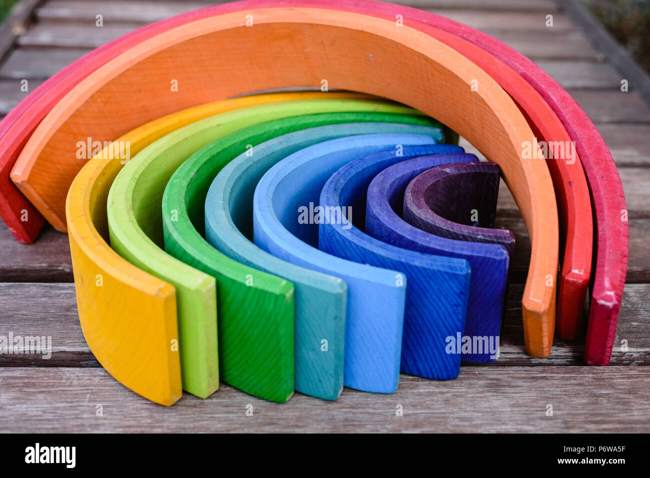 Wooden rainbow toy with many colors for children learning Stock Photo