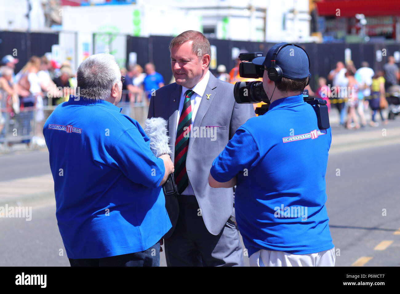 Sir Gary Verity being interviewed by Barry Robinson of Scarborough Tv News during Scarborough Armed Forces Day. Stock Photo