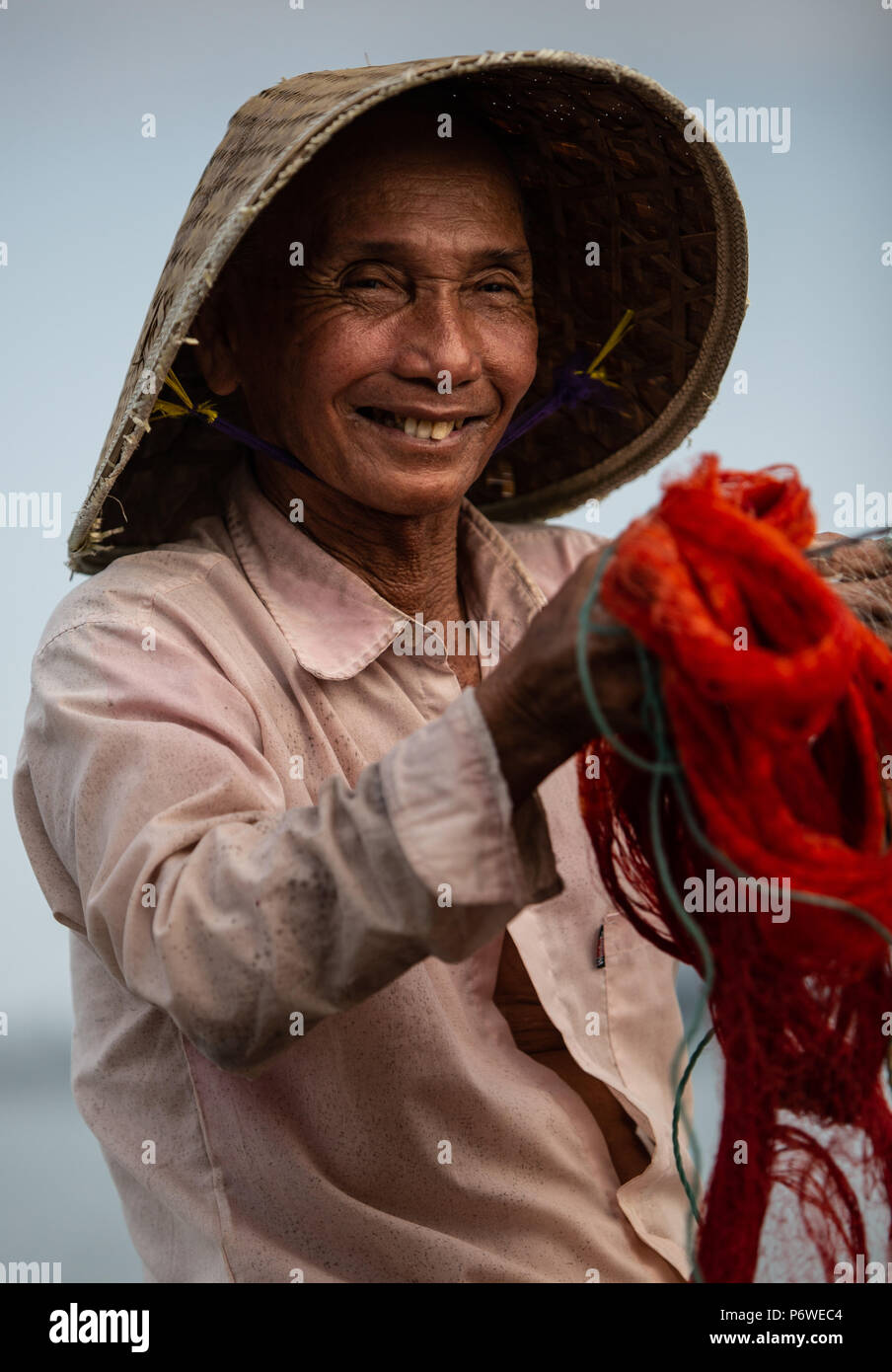 Happy Vietnamese Fisherman about to Cast his net Stock Photo - Alamy