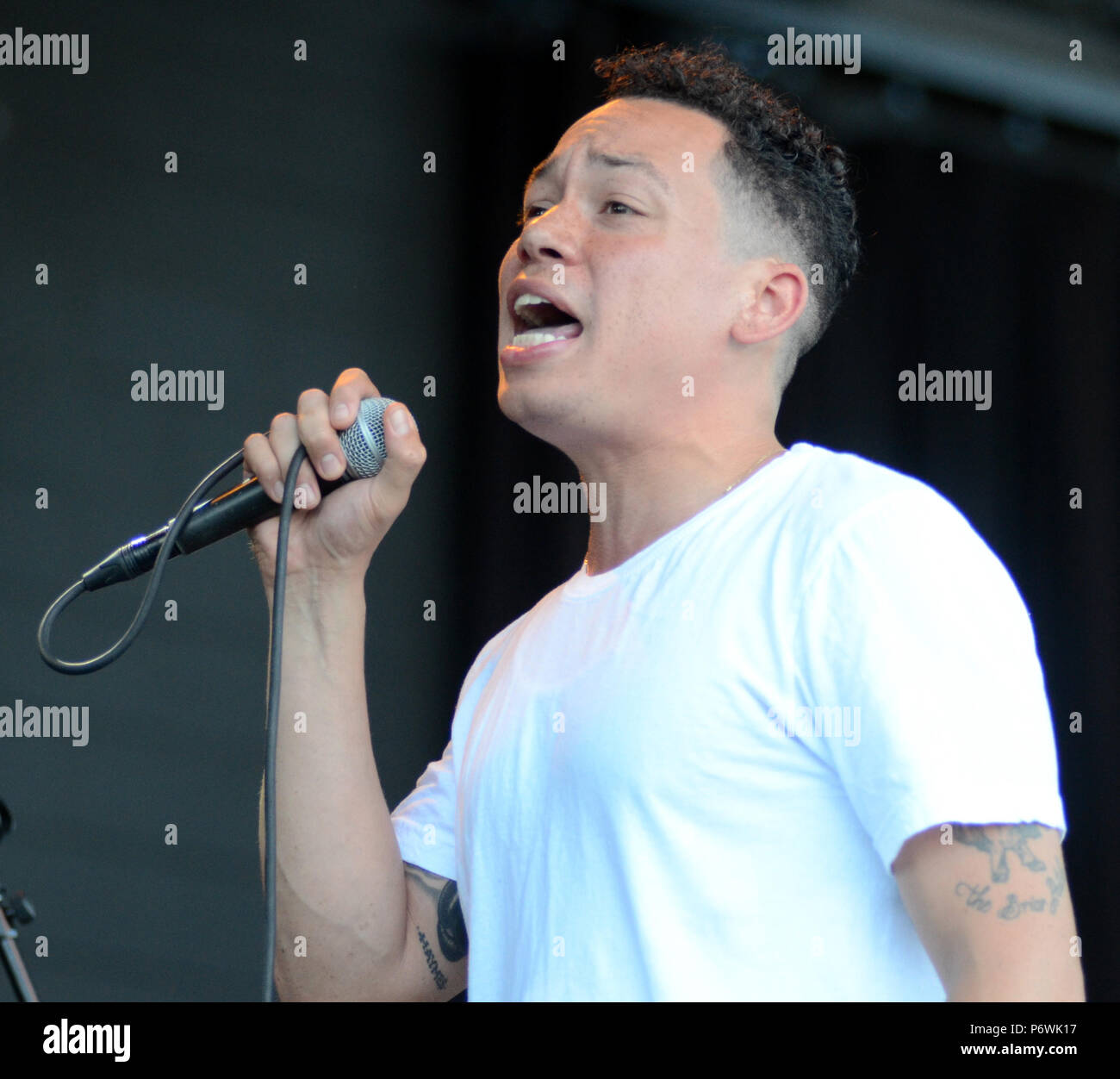 Milwaukee, Wisconsin, USA. 29th June, 2018. Lead singer Maceo Haymes of The O'My's performs live at Henry Maier Festival Park during Summerfest in Milwaukee, Wisconsin. Ricky Bassman/Cal Sport Media/Alamy Live News Stock Photo
