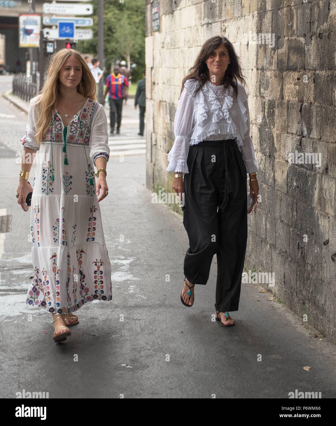 A chic showgoer and Emmanuelle Alt posing outside of the Vetements ...