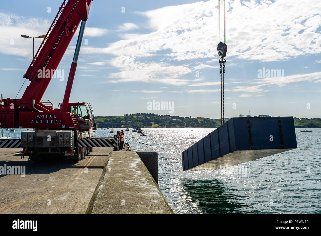Schull, West Cork, Ireland. 3rd July, 2018. Contractors lift a section of the new pontoon into the water in Schull Harbour. The whole project will take approximately 4 weeks and will cost in the region of €800,000. Credit: Andy Gibson/Alamy Live News. Stock Photo