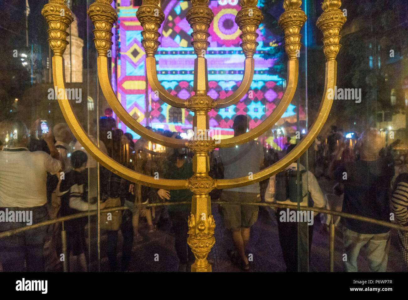 Jerusalem, Israel. 2nd July, 2018. A recreation of the Second temple's Gold Menorah (candelabrum), stands in front of Tom Dekyvere's 'Apparatus Florius' light show, which is projected on the walls of 'HaHurva' ('The Ruin') synagogue in the old city of Jerusalem during The 2018 Festival of lights. This is the 10th anniversary of the festival, festival, israel, jerusalem, Jerusalem. The Festival of Lights in the Old city, jewish, which draws hundreds of thousands of visitors to the old city of Jerusalem, which is lit by many light sculptures and shows Credit: Yagil Henkin/Alamy Live News Stock Photo