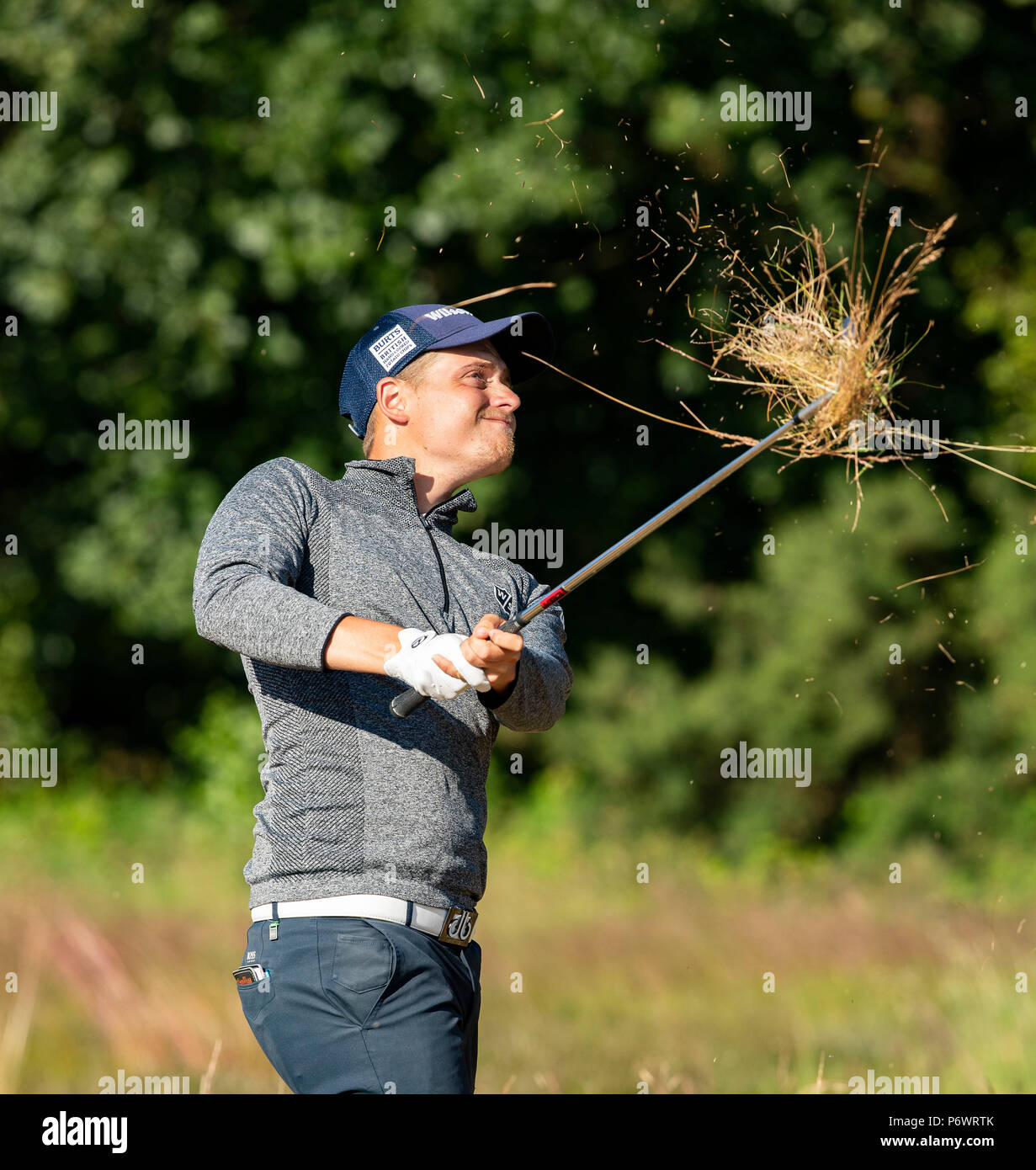 The Notts Golf Club, Nottinghamshire, UK. 3rd July 2018, Open Qualifier, The Notts Golf Club, The grass is flying as a shot is played from the rough Credit: David Kissman/Alamy Live News Stock Photo