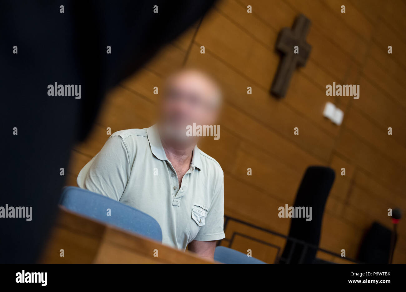 Germany, Traunstein. 03rd July, 2018. The 63 year old defendant who is charged for 2 murders is in the court room of the City court. The man is said to have killed two men in a pub in September 2017 and seriously injured the landlady and her acquaintances. (Attention: the defendant was defaced as requested by his lawyers.) Credit: Sven Hoppe/dpa - ATTENTION: individual(s) has/have been pixelated for legal reasons/dpa/Alamy Live News Stock Photo