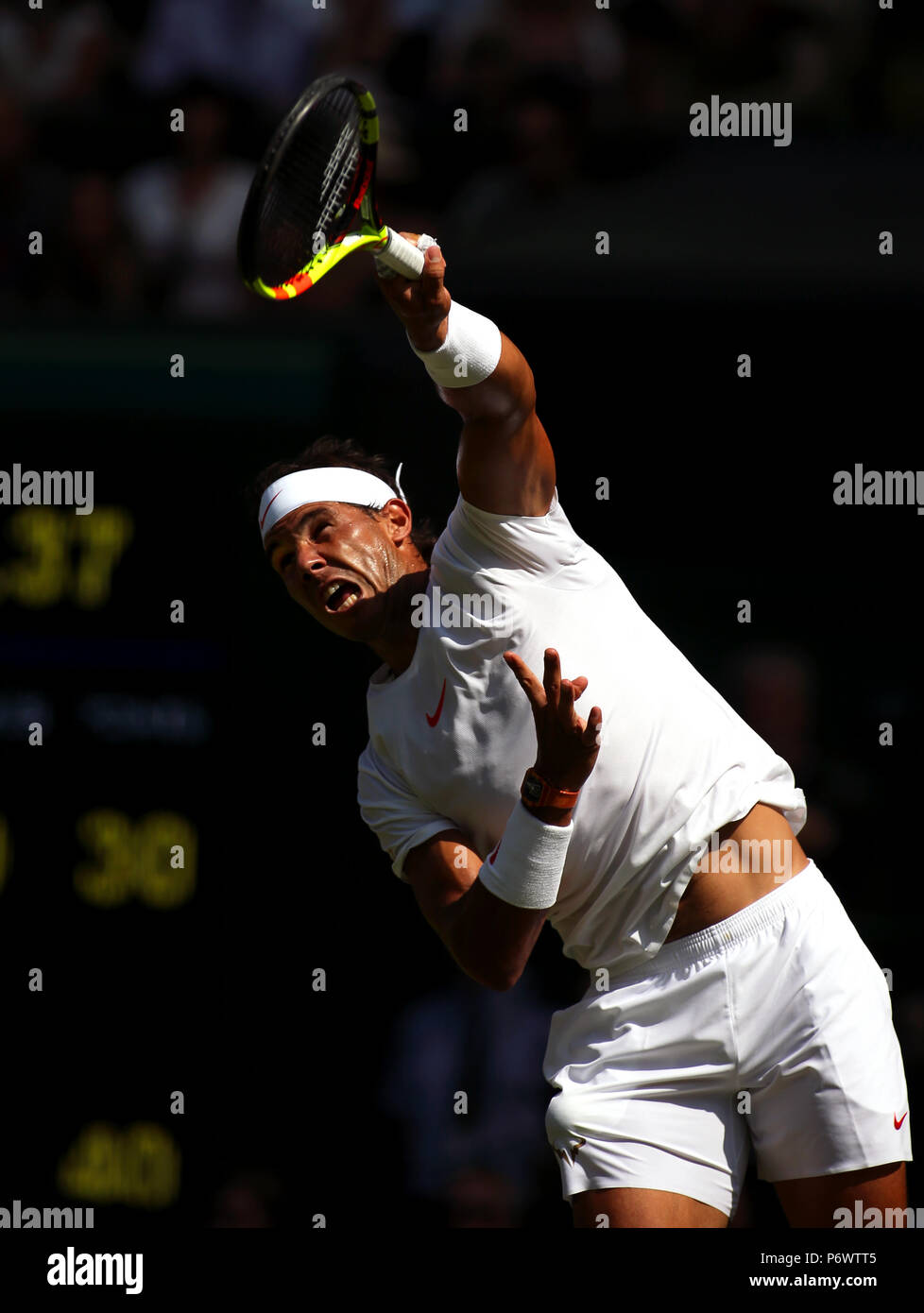 London, England - July 3rd, 2018.  Number two seed, Rafael Nadal of Spain serving to Dudi Sela of Israel during first round action at Wimbledon today. Credit: Adam Stoltman/Alamy Live News Stock Photo
