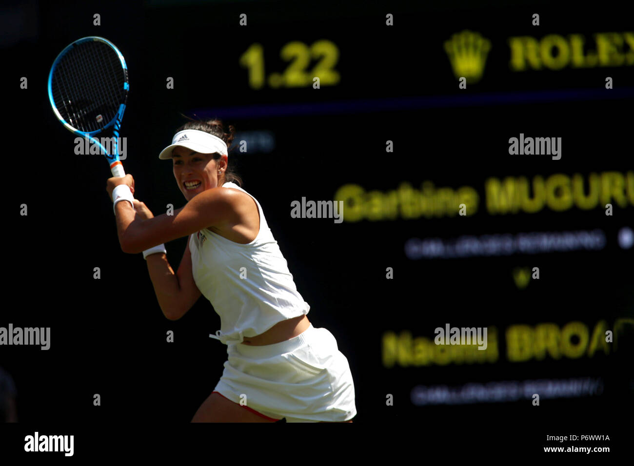 London, England - July 3rd, 2018.  Garabine Muguruza of Spain in action against Naomi Broady of Great Britain in first round action at Wimbledon today. Credit: Adam Stoltman/Alamy Live News Stock Photo