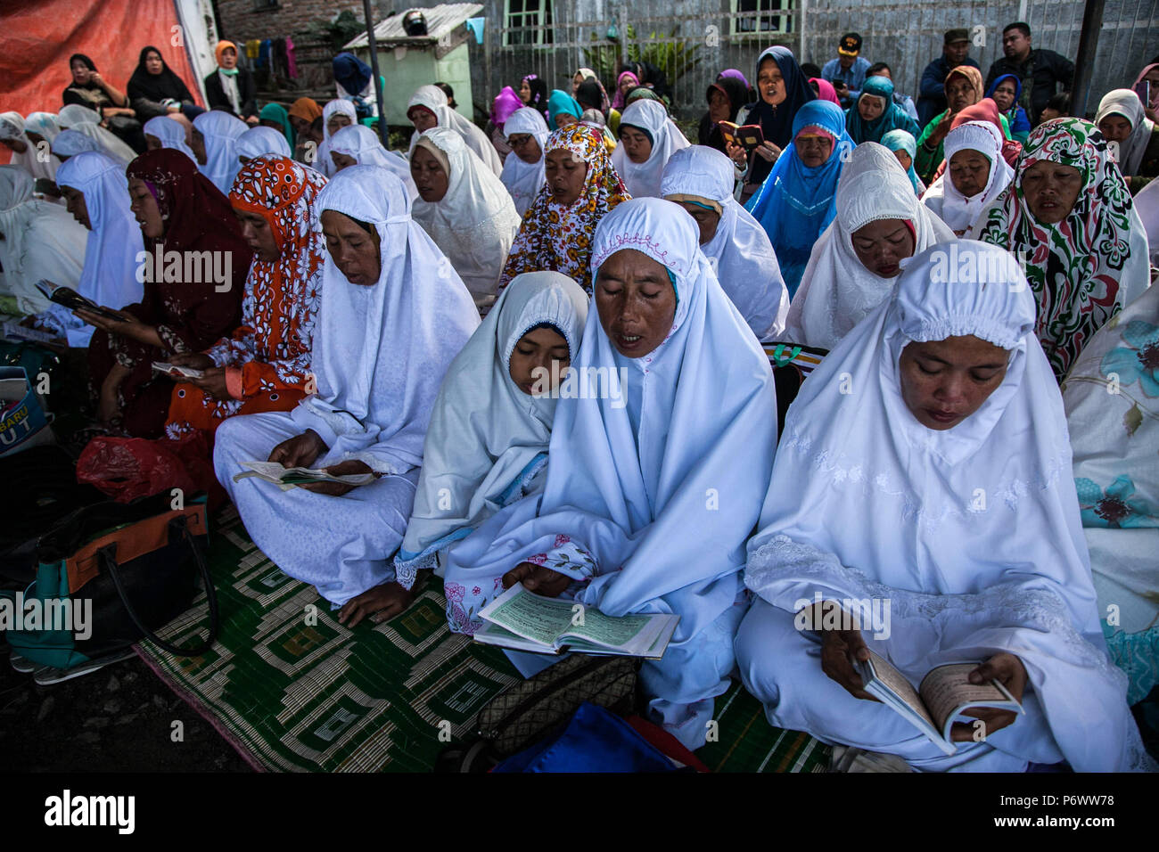 Simalungun, North Sumatra, Indonesia. 3rd July, 2018. Family members of missing victims of a capsized ferry mourn during a mass memorial service at Lake Toba in North Sumatra. The retrieval of scores of bodies from an Indonesian ferry that sunk into the depths of one of the world's deepest lakes is being called off, a rescue official said on July 2. Credit: Ivan Damanik/ZUMA Wire/Alamy Live News Stock Photo