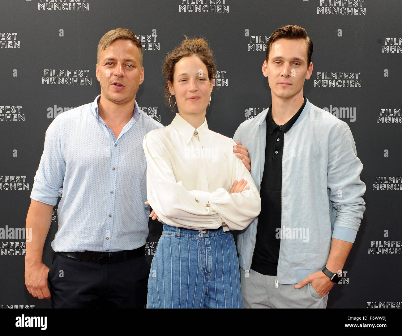 03 July 2018, Germany, Munich: Actors Tom Wlaschiha (left to right), Vicky  Krieps and Rick Okon arriving to a photo shoot for the series "Das Boot"  ('The Boat') during the Munich International