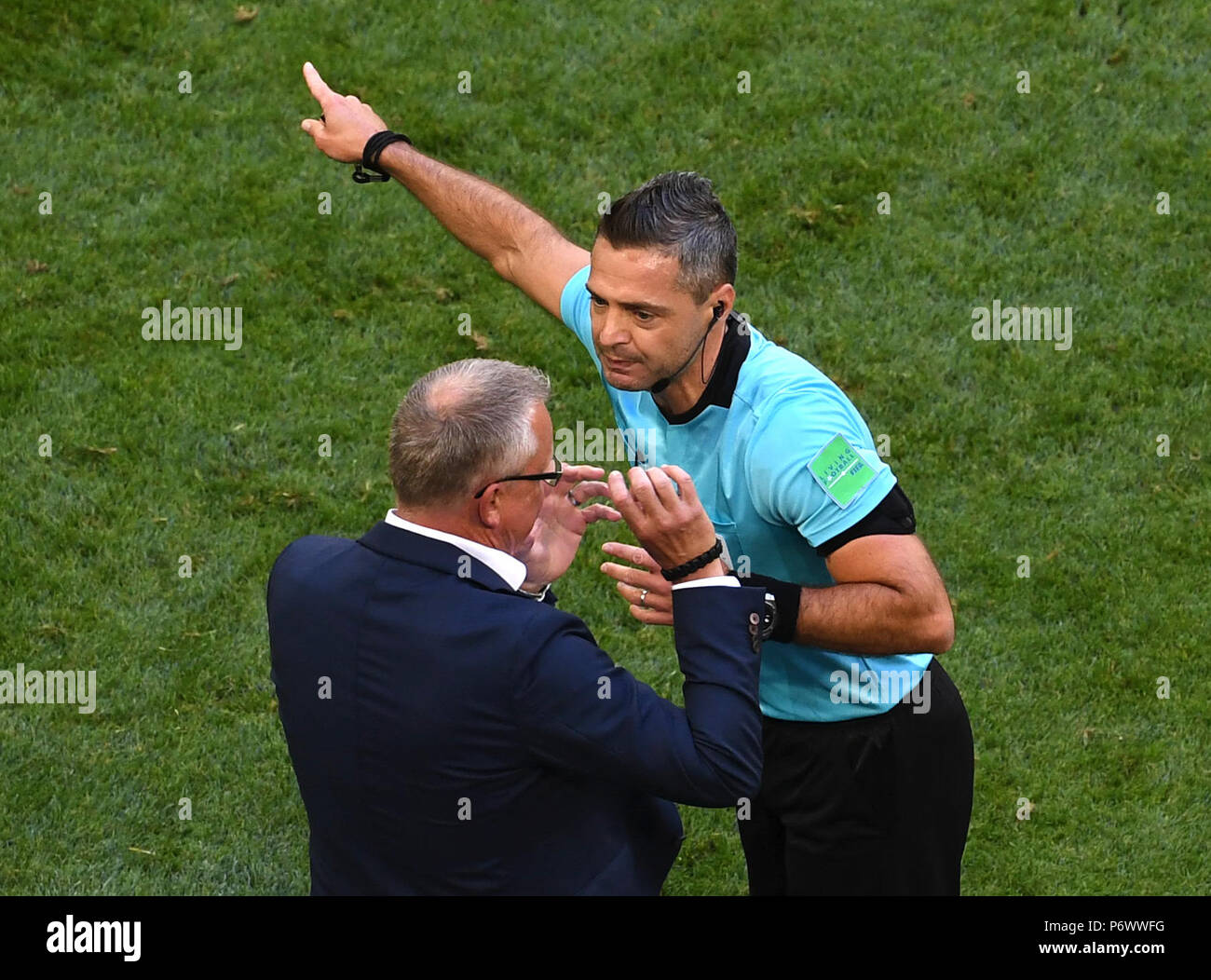 Saint Petersburg, Russia. 3rd July, 2018. The referee talks with head coach Janne Andersson (L) of Sweden during the 2018 FIFA World Cup round of 16 match between Switzerland and Sweden in Saint Petersburg, Russia, July 3, 2018. Credit: Wang Yuguo/Xinhua/Alamy Live News Stock Photo