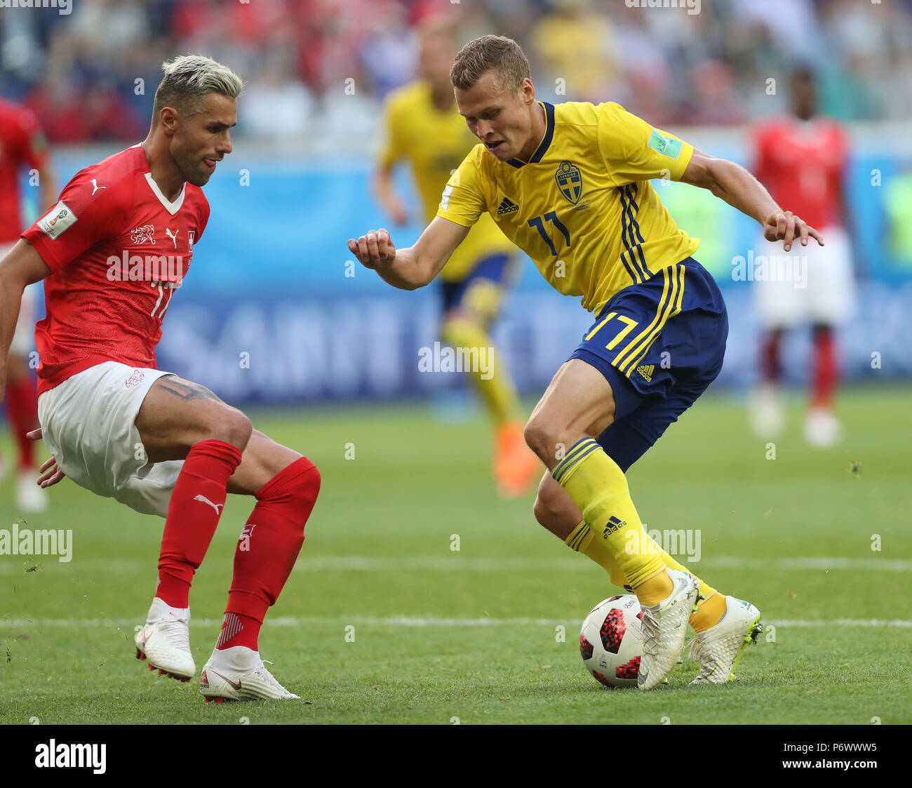 Saint Petersburg, Russia. 3rd July, 2018. Valon Behrami (L) of Switzerland vies with Viktor Claesson of Sweden during the 2018 FIFA World Cup round of 16 match between Switzerland and Sweden in Saint Petersburg, Russia, July 3, 2018. Sweden won 1-0 and advanced to the quarter-final. Credit: Cao Can/Xinhua/Alamy Live News Stock Photo