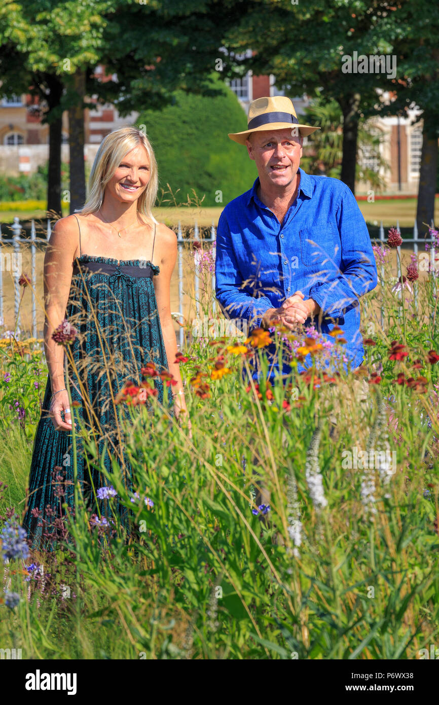 London, UK. 2nd-8th July 2018. RHS Hampton Court Flower Show. Radio DJ Jo Whiley and garden designer and TV celebrity Joe Swift broadcasting from the perennial meadow-style  borders designed by Dutch landscape designer, plantsman and author Piet Oudolf.   - Designer:  Piet Oudolf Stock Photo