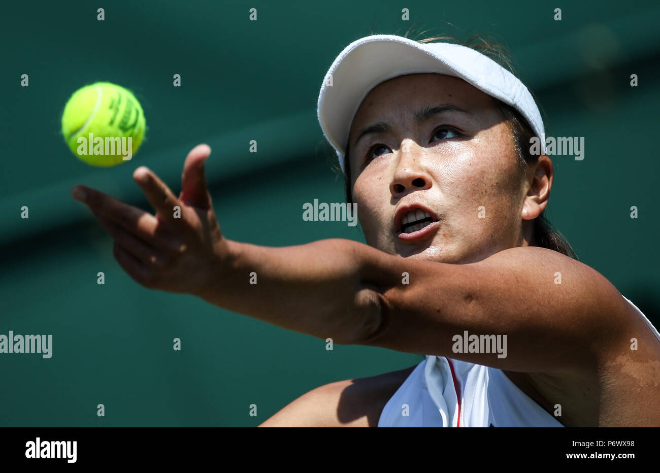 (180703) -- LONDON, July 3, 2018 (XINHUA) -- Peng Shuai of China serves during the women's singles first round match against Samantha Stosur of Australia at the Championship Wimbledon 2018 in London, Britain, on July 3, 2018. Samantha Stosur won 2-0. (Xinhua/Tang Shi) Stock Photo