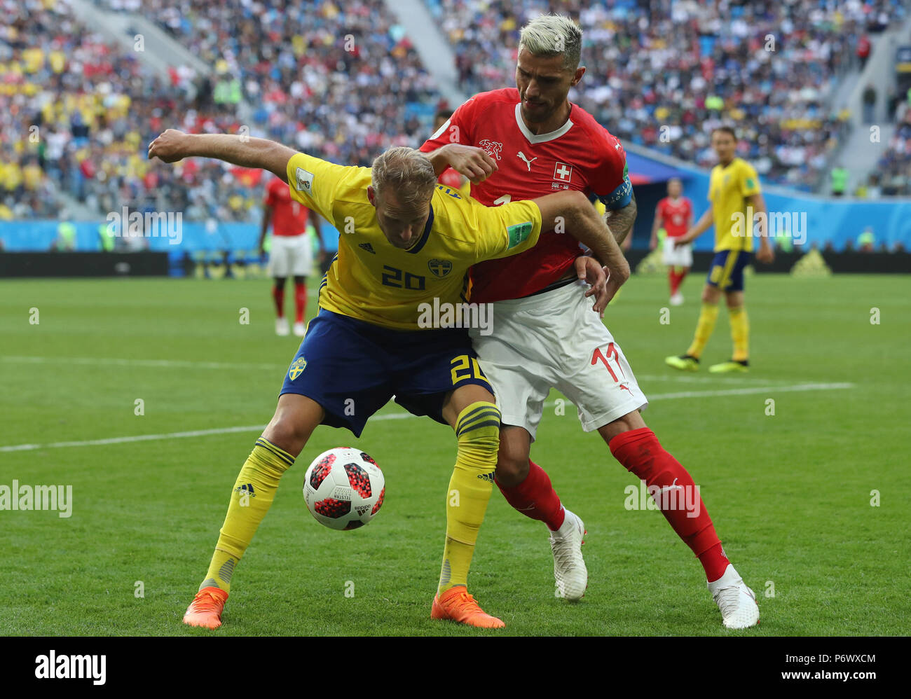 Saint Petersburg, Russia. 3rd July, 2018. Valon Behrami (R) of Switzerland vies with Ola Toivonen of Sweden during the 2018 FIFA World Cup round of 16 match between Switzerland and Sweden in Saint Petersburg, Russia, July 3, 2018. Sweden won 1-0 and advanced to the quarter-final. Credit: Cao Can/Xinhua/Alamy Live News Stock Photo