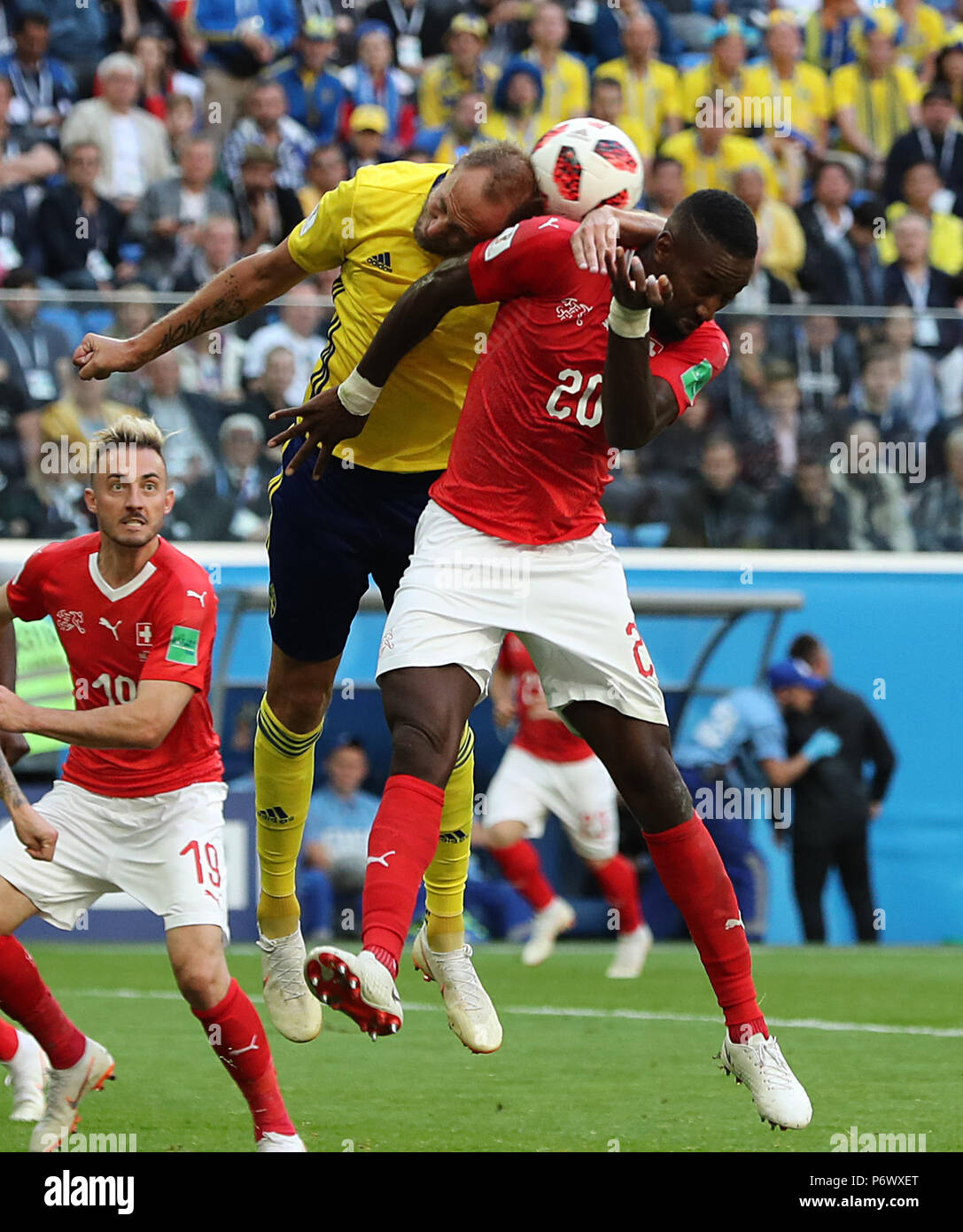Saint Petersburg, Russia. 3rd July, 2018. Johan Djourou (R) of Switzerland competes for a header with Andreas Granqvist of Sweden during the 2018 FIFA World Cup round of 16 match between Switzerland and Sweden in Saint Petersburg, Russia, July 3, 2018. Sweden won 1-0 and advanced to the quarter-final. Credit: Yang Lei/Xinhua/Alamy Live News Stock Photo