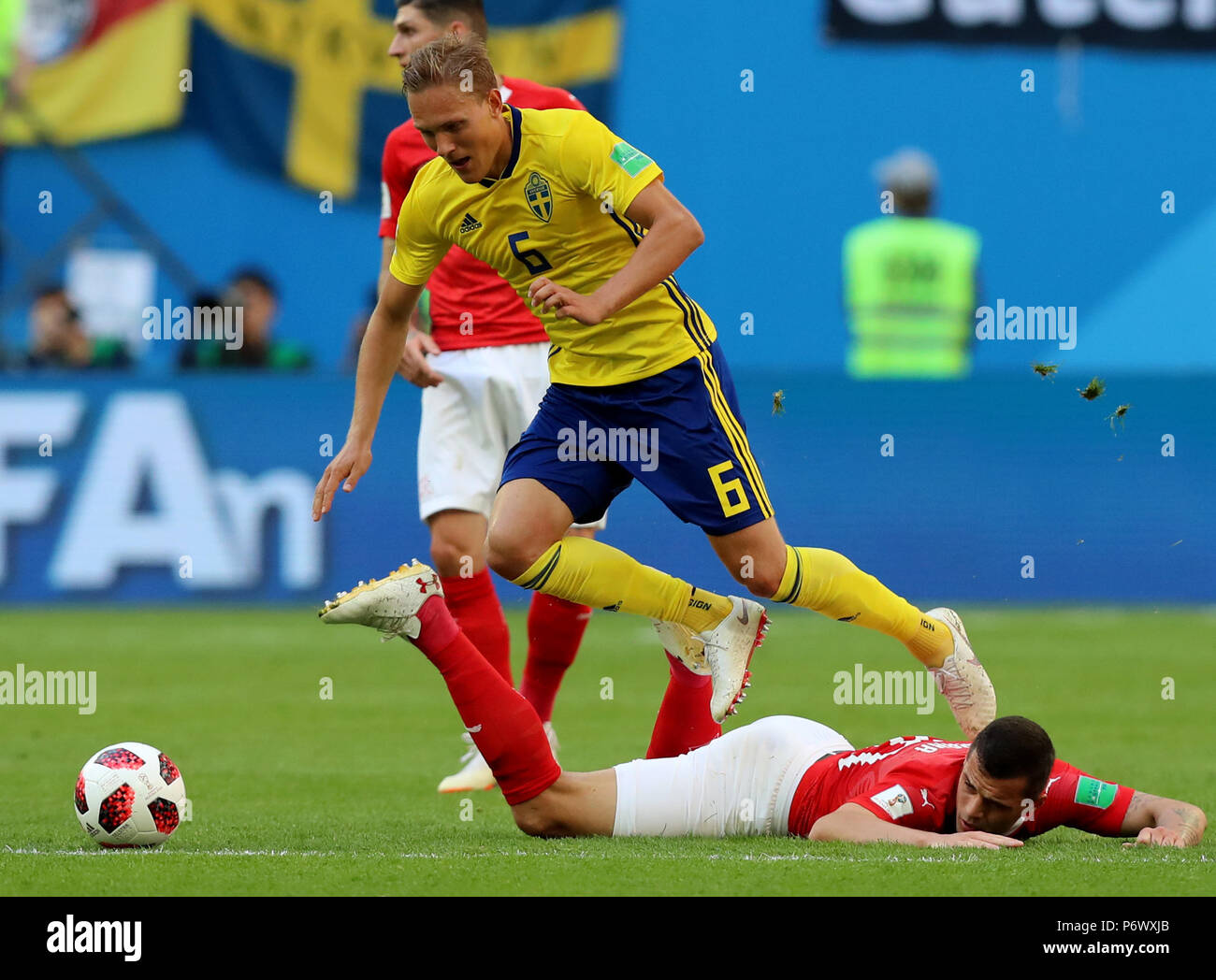 Saint Petersburg, Russia. 3rd July, 2018. Granit Xhaka (bottom) of Switzerland vies with Ludwig Augustinsson of Sweden during the 2018 FIFA World Cup round of 16 match between Switzerland and Sweden in Saint Petersburg, Russia, July 3, 2018. Credit: Yang Lei/Xinhua/Alamy Live News Stock Photo