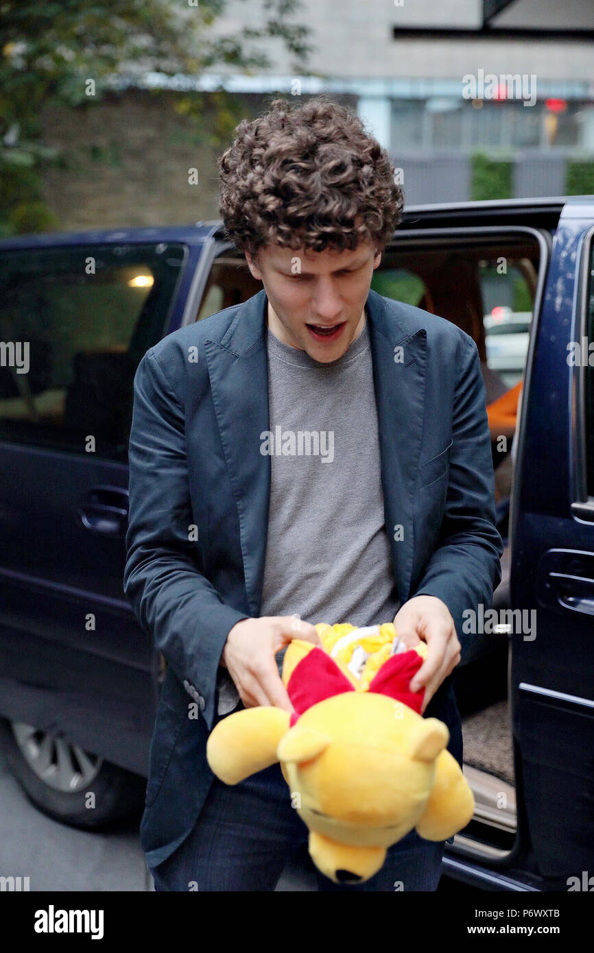 Shanghai, China. 3rd July, 2018. American actor Jesse Eisenberg gets a toy bear as present from his fans during his visit in Shanghai, China. Credit: SIPA Asia/ZUMA Wire/Alamy Live News Stock Photo