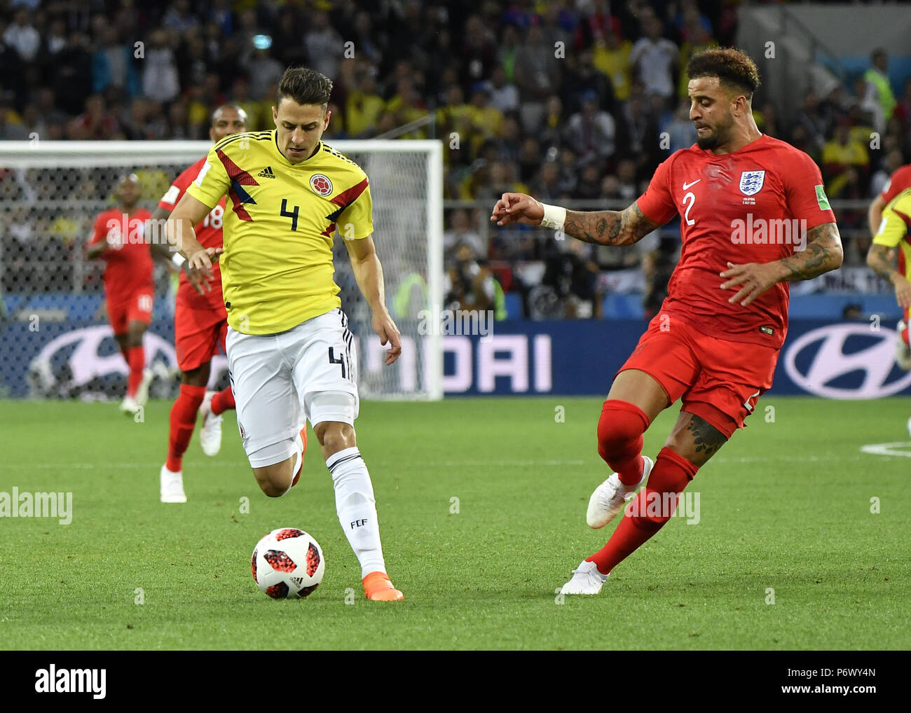 Moscow, Russia. 3rd July, 2018. Kyle Walker (R) of England vies with Santiago Arias of Colombia during the 2018 FIFA World Cup round of 16 match between England and Colombia in Moscow, Russia, July 3, 2018. Credit: He Canling/Xinhua/Alamy Live News Stock Photo