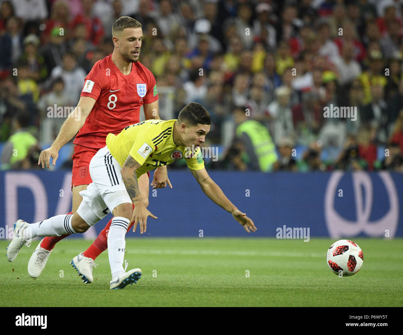 Moscow, Russia. 3rd July, 2018. Jordan Henderson (L) of England vies with Juan Quintero of Colombia during the 2018 FIFA World Cup round of 16 match between England and Colombia in Moscow, Russia, July 3, 2018. Credit: Lui Siu Wai/Xinhua/Alamy Live News Stock Photo