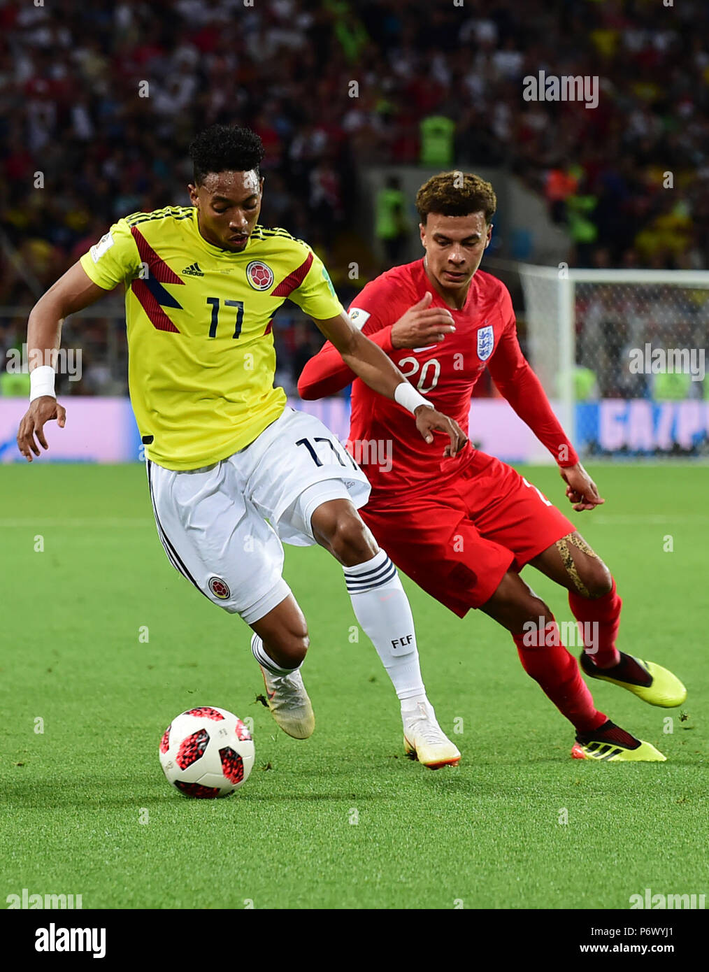Moscow, Russia. 3rd July, 2018. Dele Alli (R) of England vies with Johan Mojica of Colombia during the 2018 FIFA World Cup round of 16 match between England and Colombia in Moscow, Russia, July 3, 2018. Credit: Du Yu/Xinhua/Alamy Live News Stock Photo