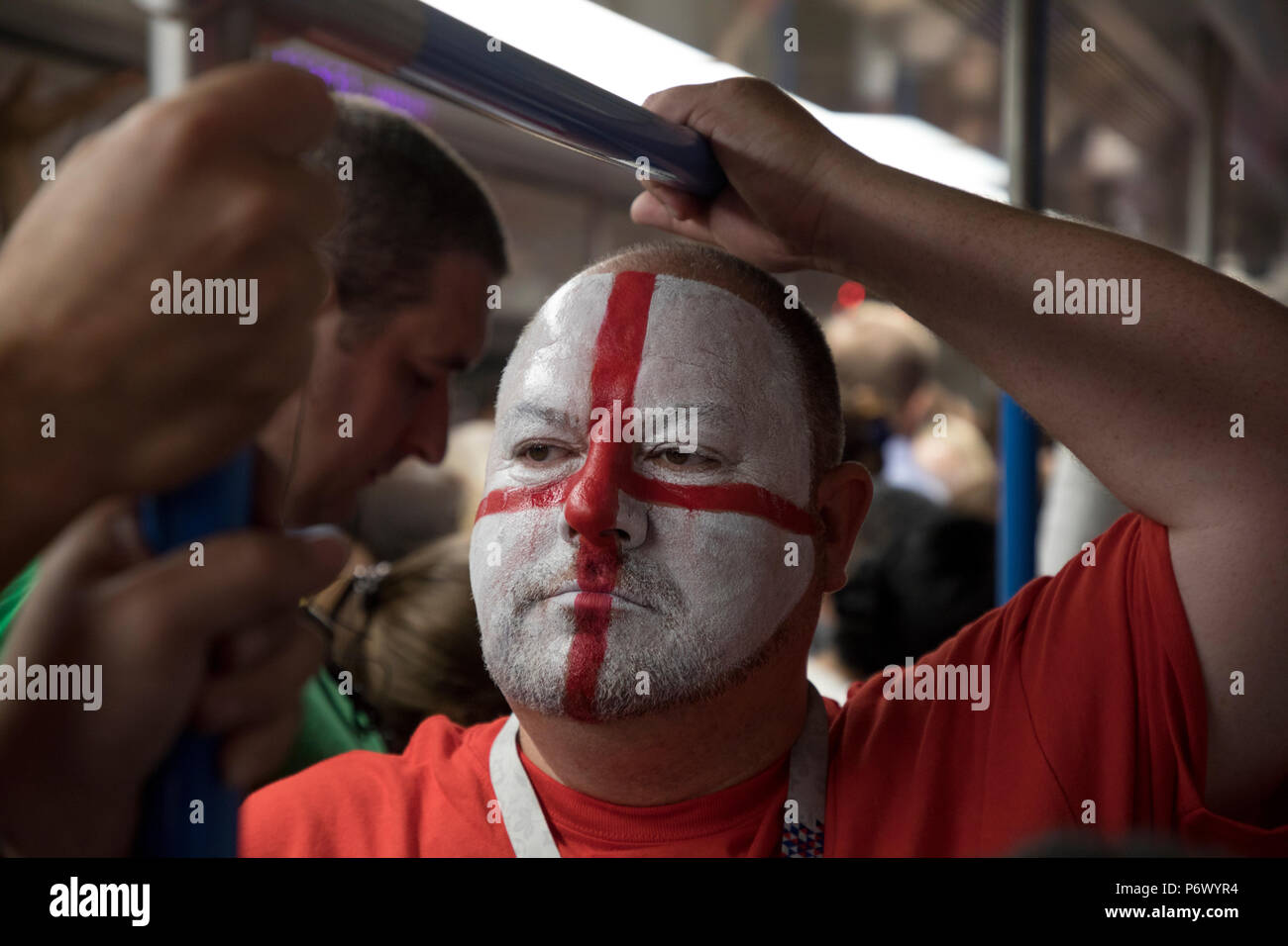 Moscow, Russia. 3th July, 2018. An English fan in Moscow underground goes to the round of 16 match between Colombia and England at the 2018 soccer World Cup in the Spartak Stadium, Russia Credit: Nikolay Vinokurov/Alamy Live News Stock Photo