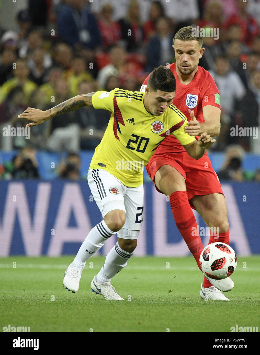 Moscow, Russia. 3rd July, 2018. Jordan Henderson (R) of England vies with Juan Quintero of Colombia during the 2018 FIFA World Cup round of 16 match between England and Colombia in Moscow, Russia, July 3, 2018. Credit: Lui Siu Wai/Xinhua/Alamy Live News Stock Photo