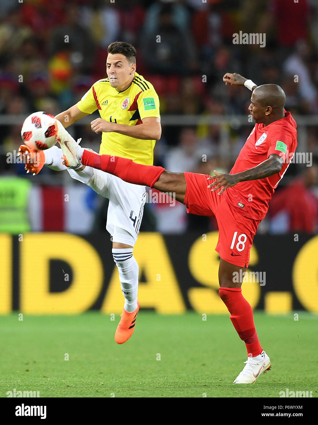 Moscow, Russia. 3rd July, 2018. Ashley Young (R) of England vies with Santiago Arias of Colombia during the 2018 FIFA World Cup round of 16 match between England and Colombia in Moscow, Russia, July 3, 2018. Credit: Du Yu/Xinhua/Alamy Live News Stock Photo