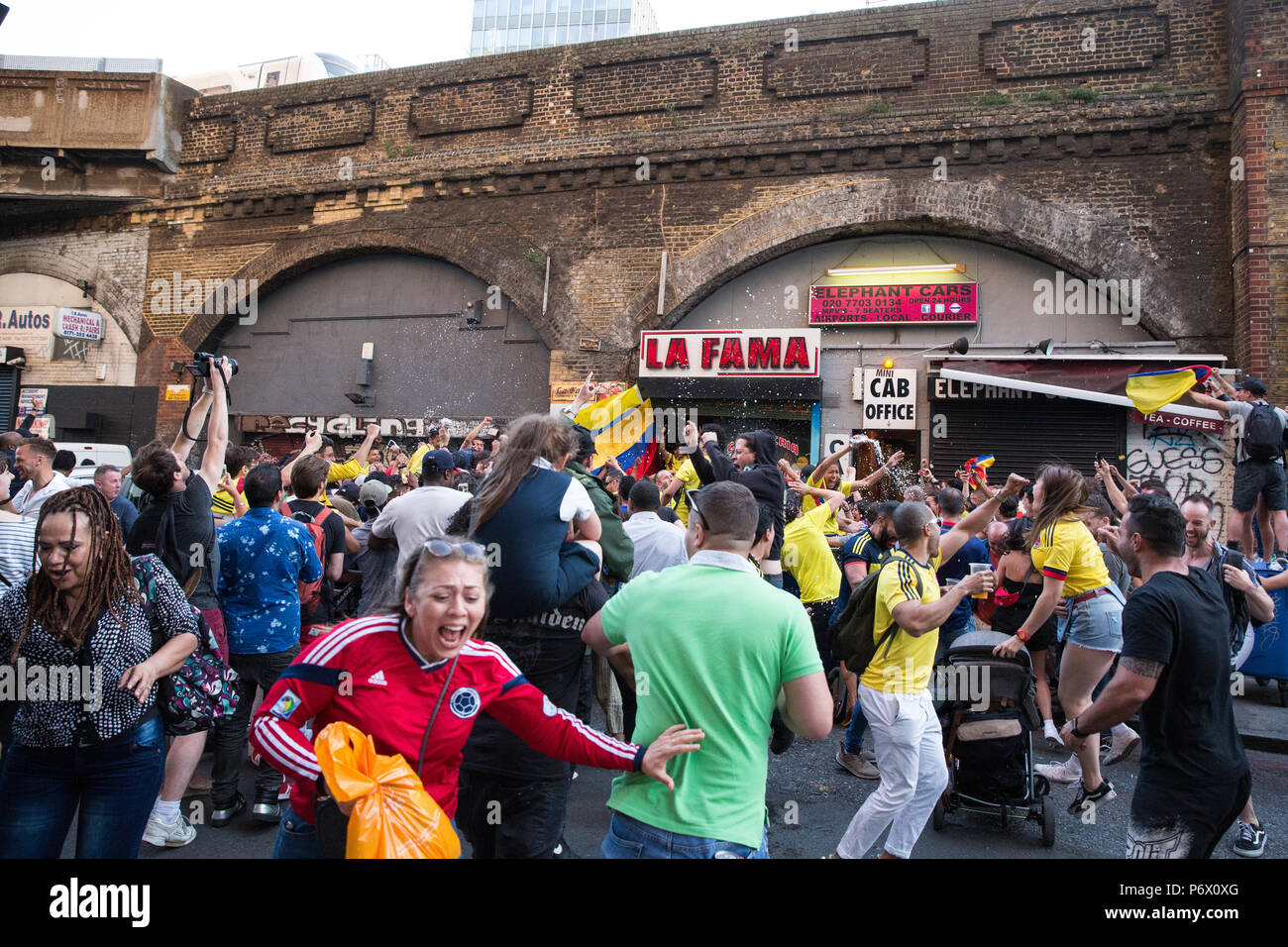 London, UK. 3rd July, 2018. Members of London's Colombian community celebrate the Colombian national football team's equalising goal against England in injury time at the end of normal time in the FIFA 2018 World Cup Last 16 match in the street outside a Colombian bar in Elephant and Castle. England eventually won the match on penalties. Credit: Mark Kerrison/Alamy Live News Stock Photo