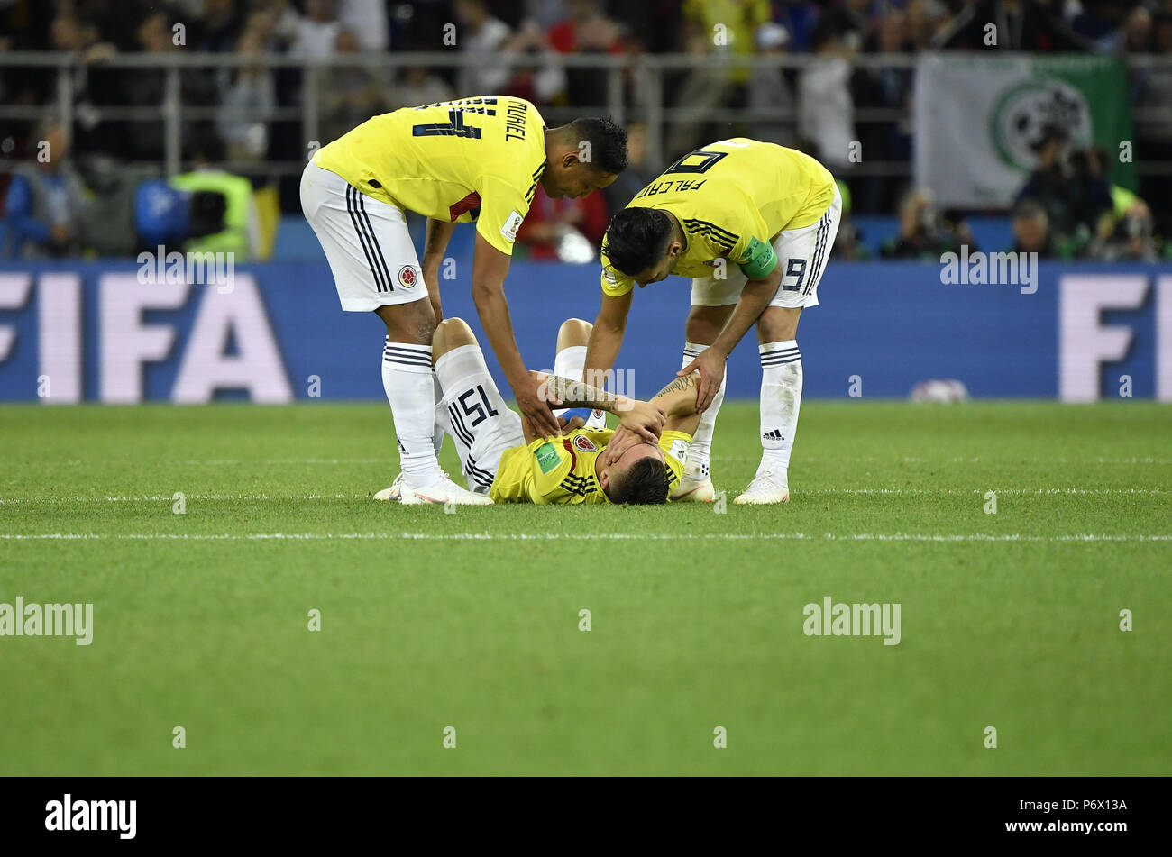 Moscow, Russia. 3rd July, 2018. Colombia's Radamel Falcao (R top) and Luis Muriel (L top) comfort Mateus Uribe after he missed a penalty kick during the penalty shootout of the 2018 FIFA World Cup round of 16 match between England and Colombia in Moscow, Russia, July 3, 2018. England won 5-4 (4-3 in penalty shootout) and advanced to the quarter-final. Credit: He Canling/Xinhua/Alamy Live News Stock Photo