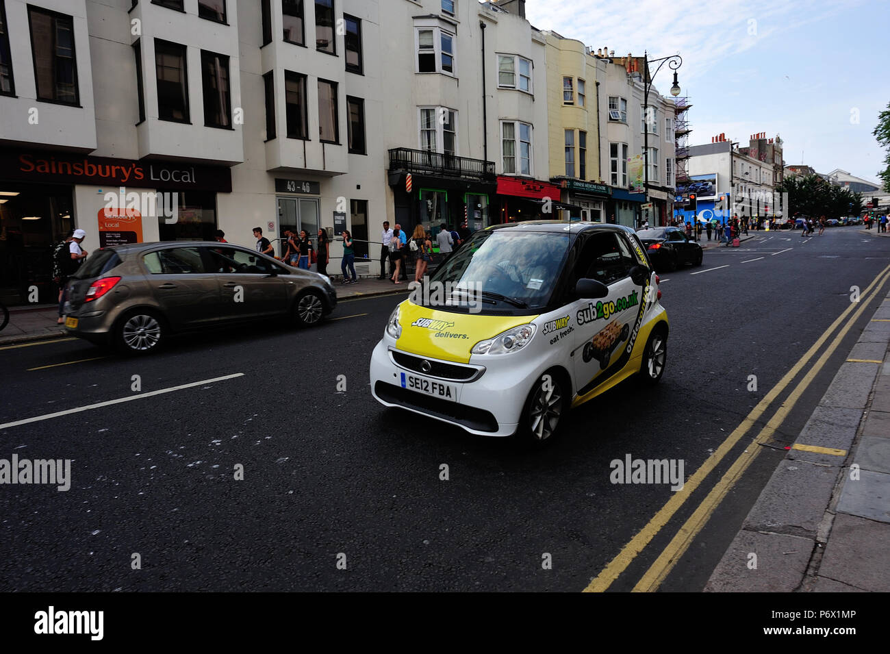 Subway smartcar making a delivery in Brighton, English Seaside Town, Brighton & Hove, East Sussex, England, UK Stock Photo