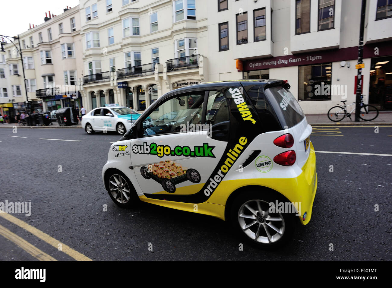 Subway smartcar making a delivery in Brighton, English Seaside Town, Brighton & Hove, East Sussex, England, UK Stock Photo
