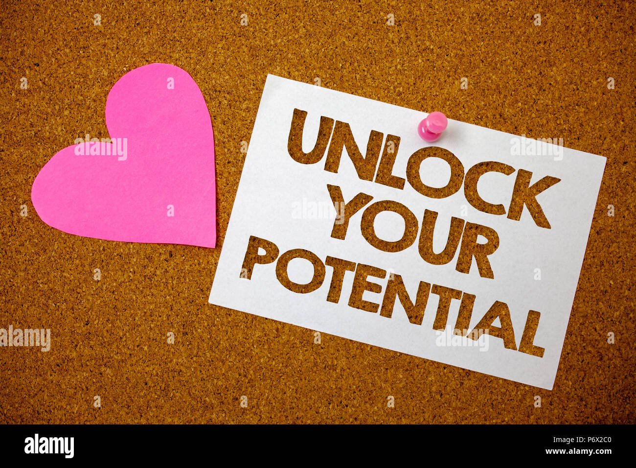 Handwriting text Unlock Your Potential. Concept meaning access your true skills and powers Believe in yourself Hart love pink brown background love lo Stock Photo