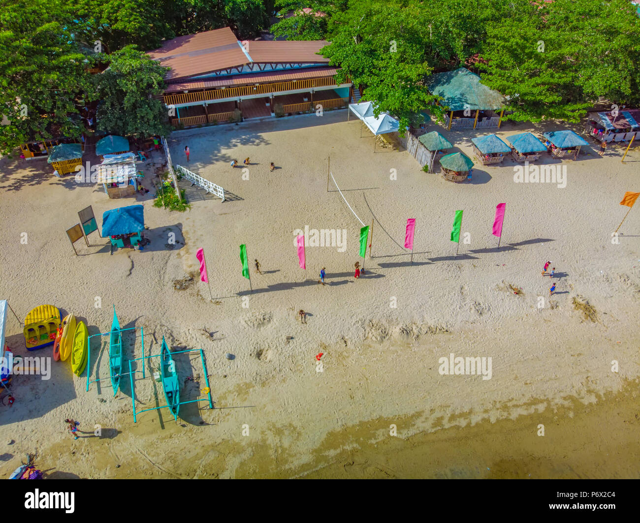 Afternoon aerial view of a beach in Laiya, Batangas with the recreational boats parked in front Stock Photo