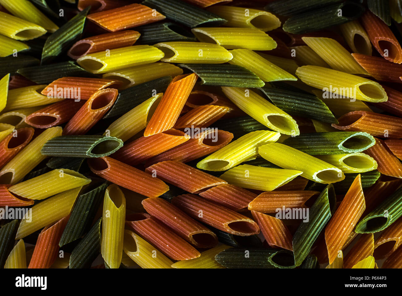 Macaroni tricolor with organic pasta integral Stock Photo - Alamy