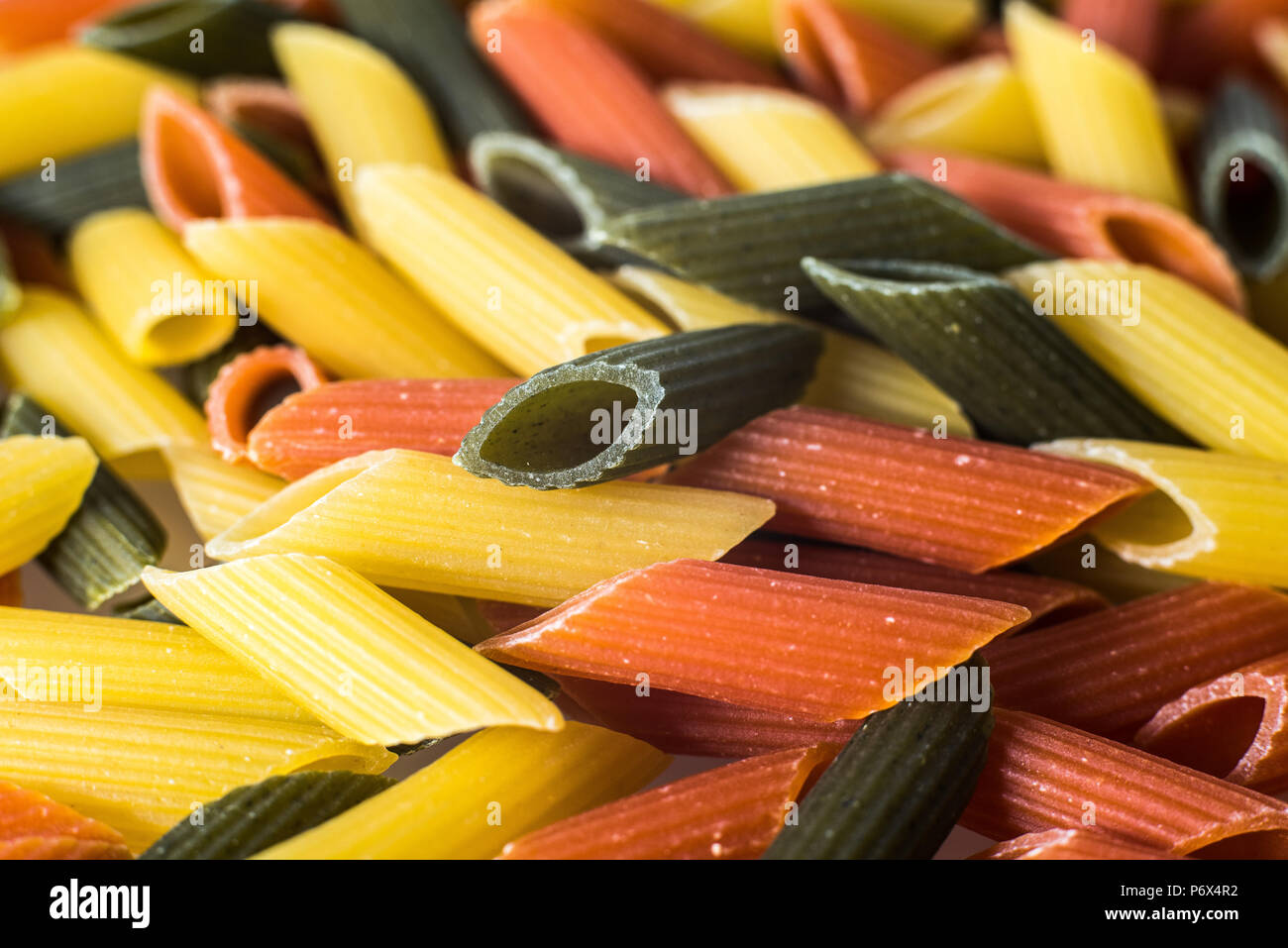 Macaroni tricolor with organic pasta integral Stock Photo - Alamy