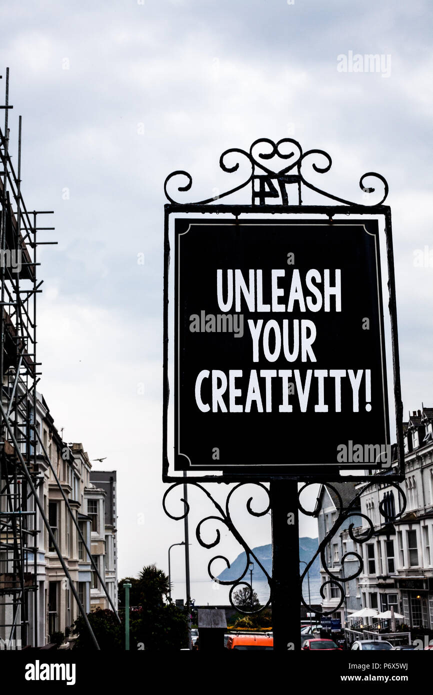 Handwriting text writing Unleash Your Creativity Call. Concept meaning Develop Personal Intelligence Wittiness Wisdom Vintage black board white letter Stock Photo