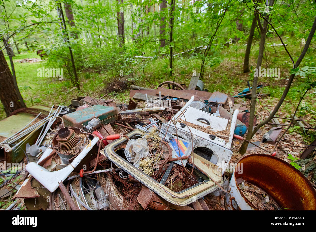 Dump old metal objects in the woods, rusty scrap metal. Environmental