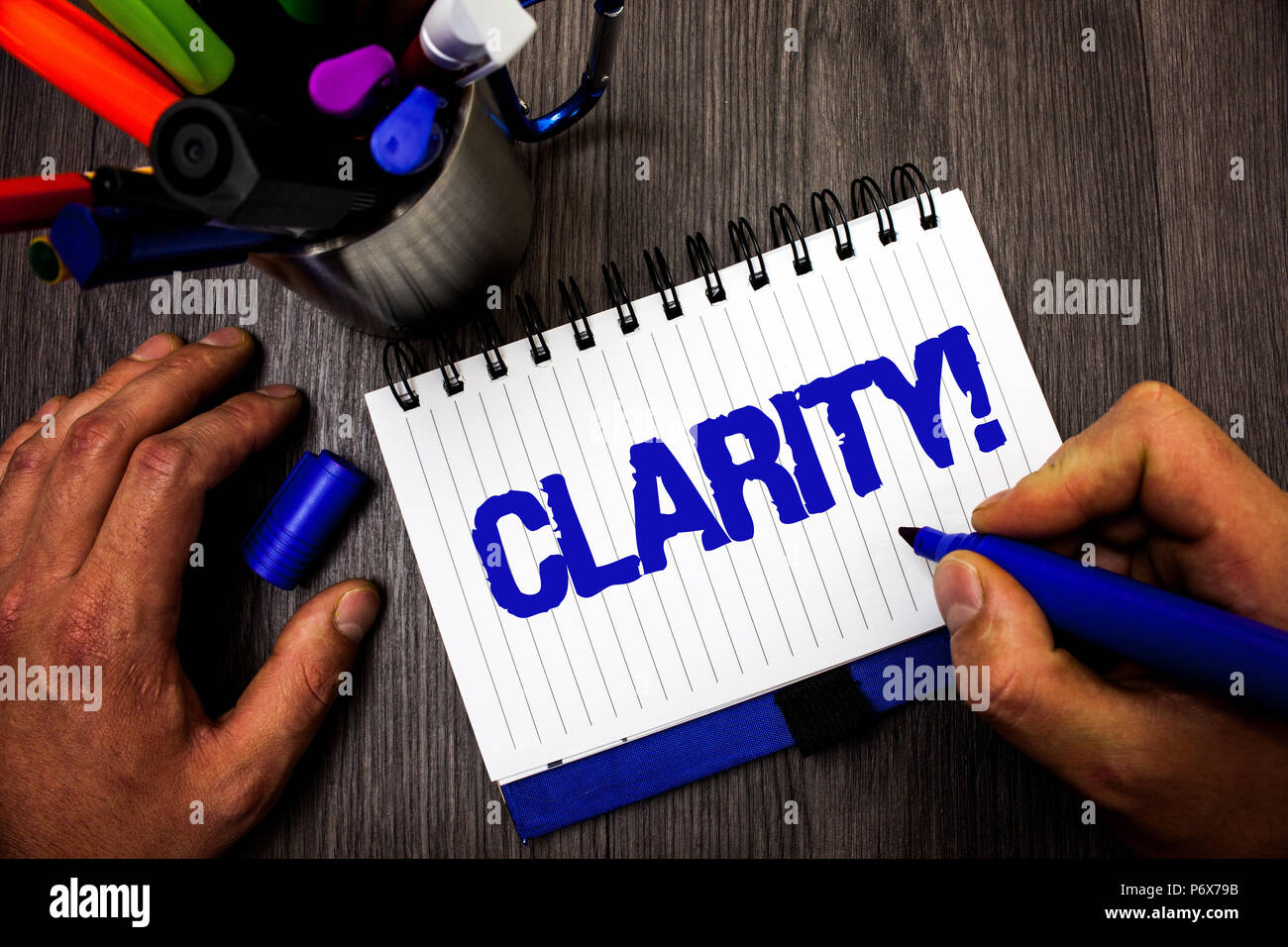 Handwriting text writing Clarity. Concept meaning Certainty Precision Purity Comprehensibility Transparency Accuracy Man hold holding marker notebook Stock Photo