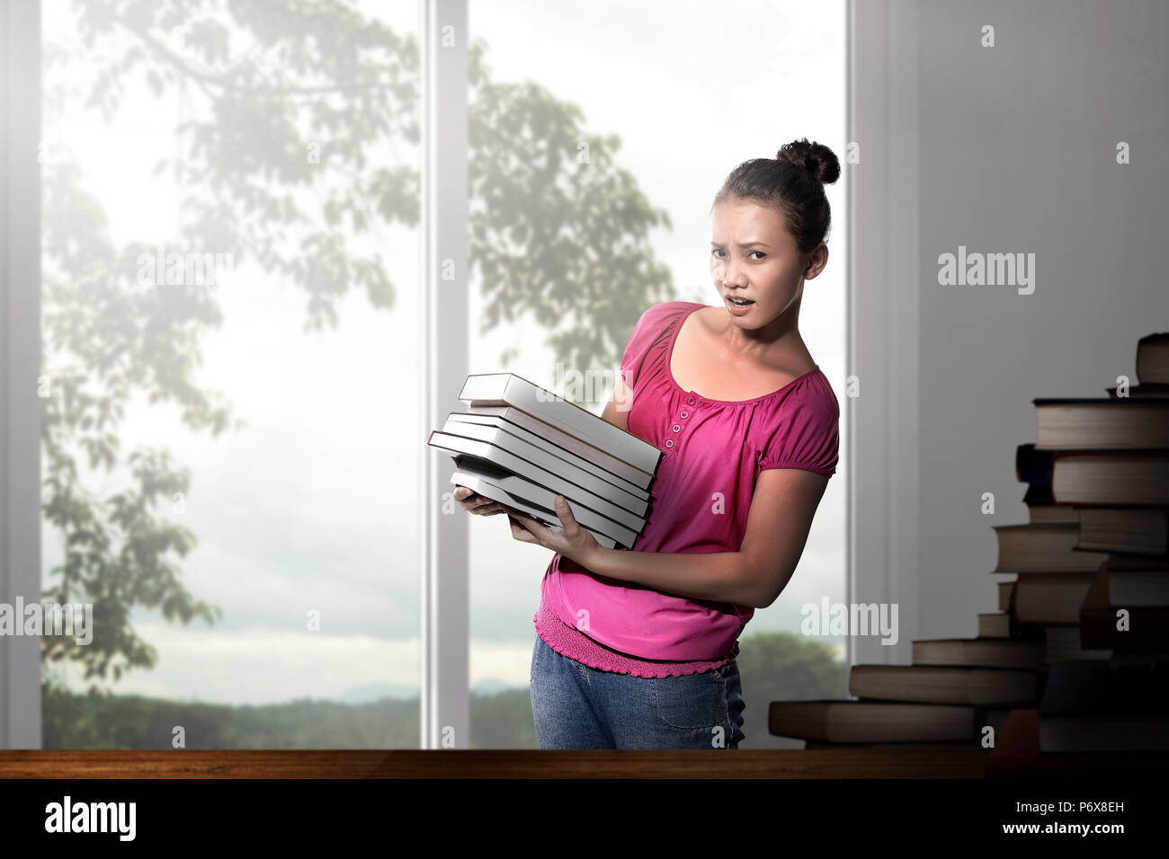 Beautiful asian woman with books on the classroom Stock Photo - Alamy