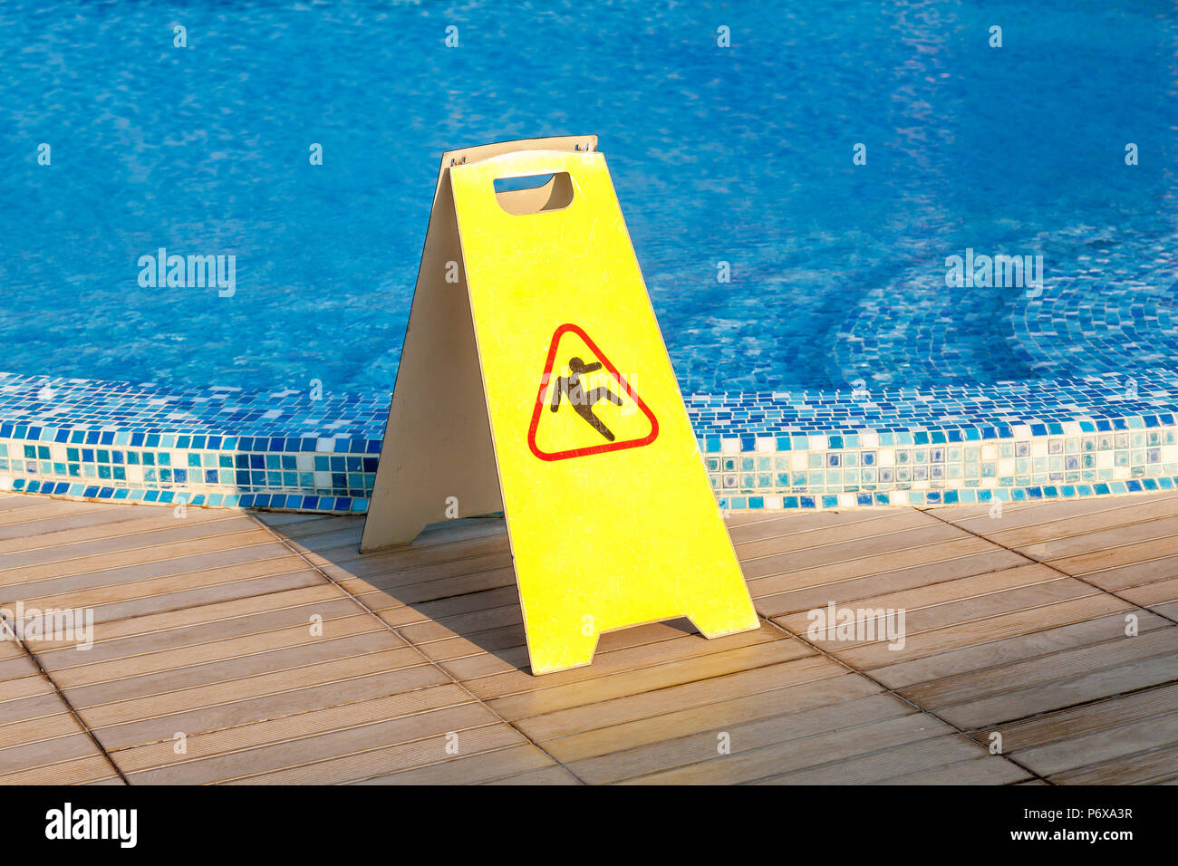 Sign slippery floor by the pool, pool slippery floor Stock Photo Alamy