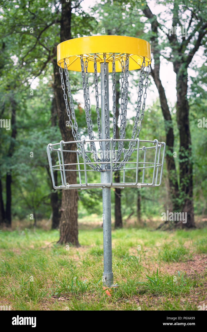 Disc golf target basket in wooded park Stock Photo Alamy
