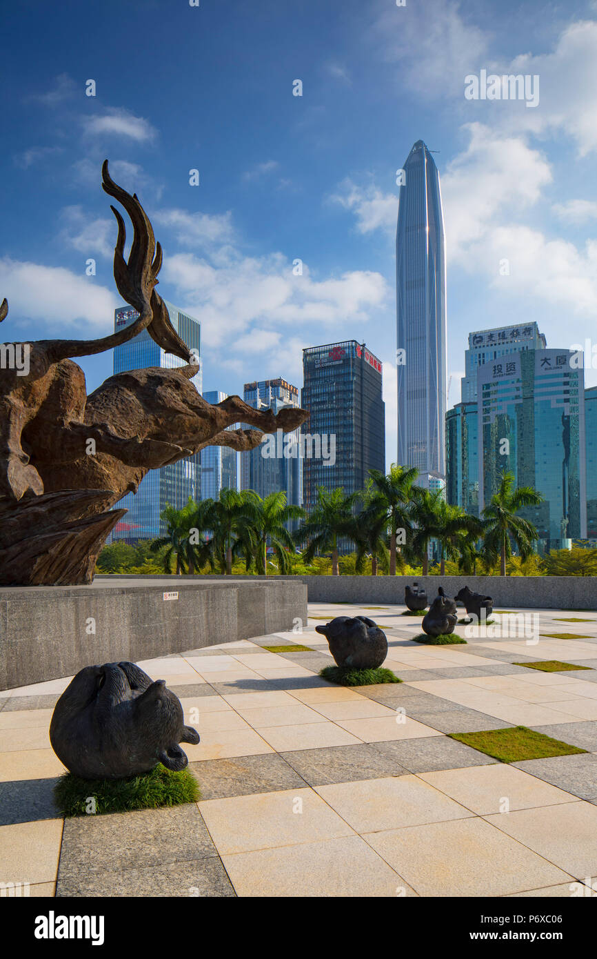 Ping An International Finance Centre (worldâ€™s 4th tallest building in 2017 at 600m) and bull and bear sculptures outside Shenzhen Stock Exchange, Futian, Shenzhen, Guangdong, China Stock Photo