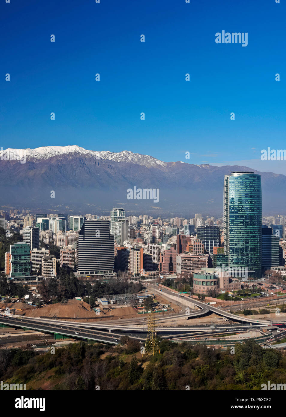 Chile, Santiago, View from the Parque Metropolitano towards the high raised buildings in financial sector. Snow covered Andes in the background. Stock Photo