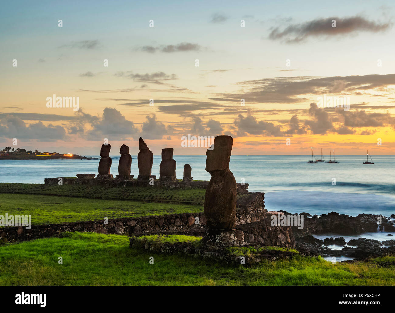 Moais in Tahai Archaeological Complex at sunset, Rapa Nui National Park, Easter Island, Chile Stock Photo